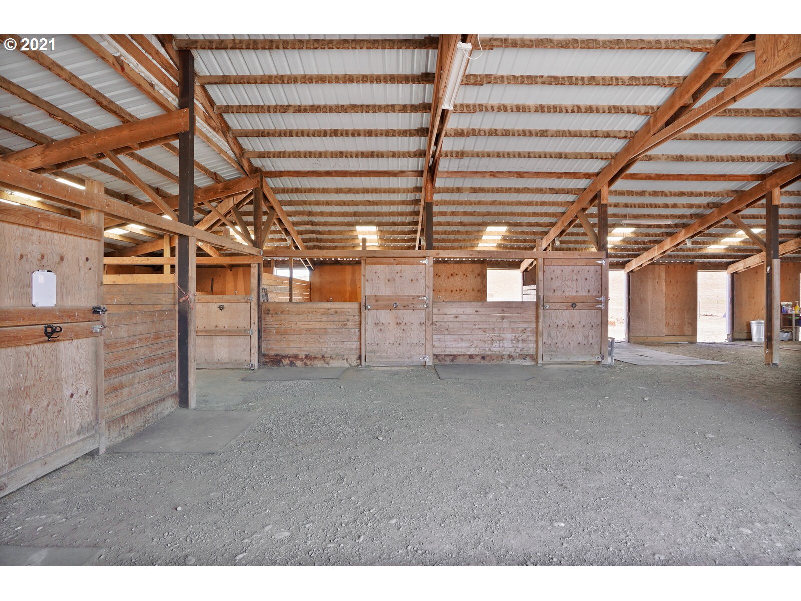 9310 Harmony Road Sheridan, OR 97378 - Photo 26 of 32 a view of a empty room with wooden ceiling