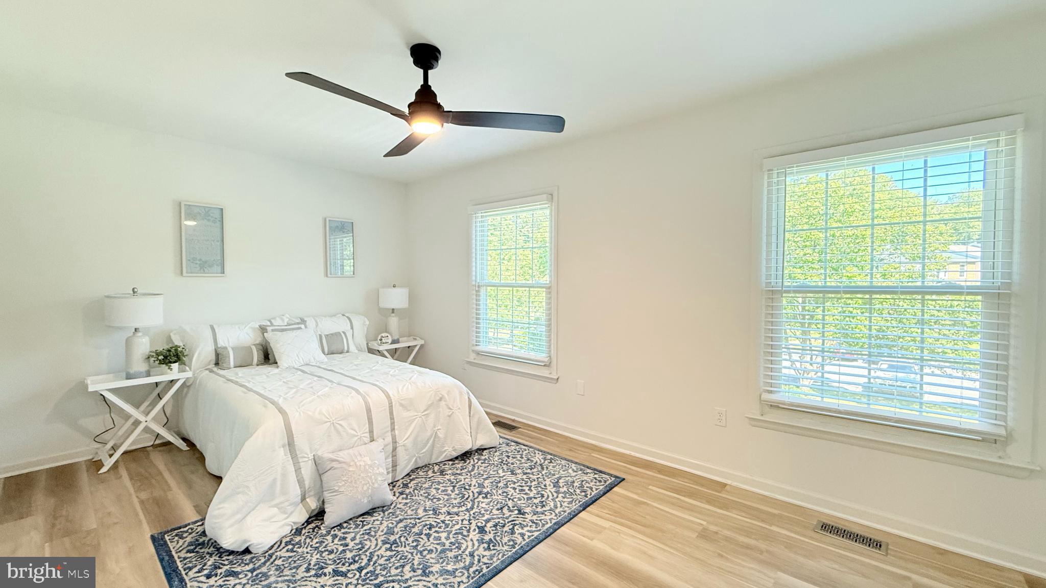 6469 Rockshire Court Alexandria, VA 22315 - Photo 14 of 19 a bedroom with a large bed and a window