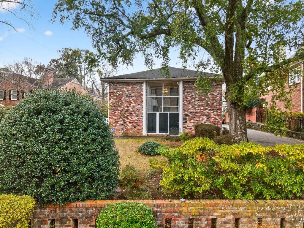 3668 Kingsboro Road Northeast, Unit 8 Atlanta, GA 30319 - Photo 4 of 43 front view of a house with a yard
