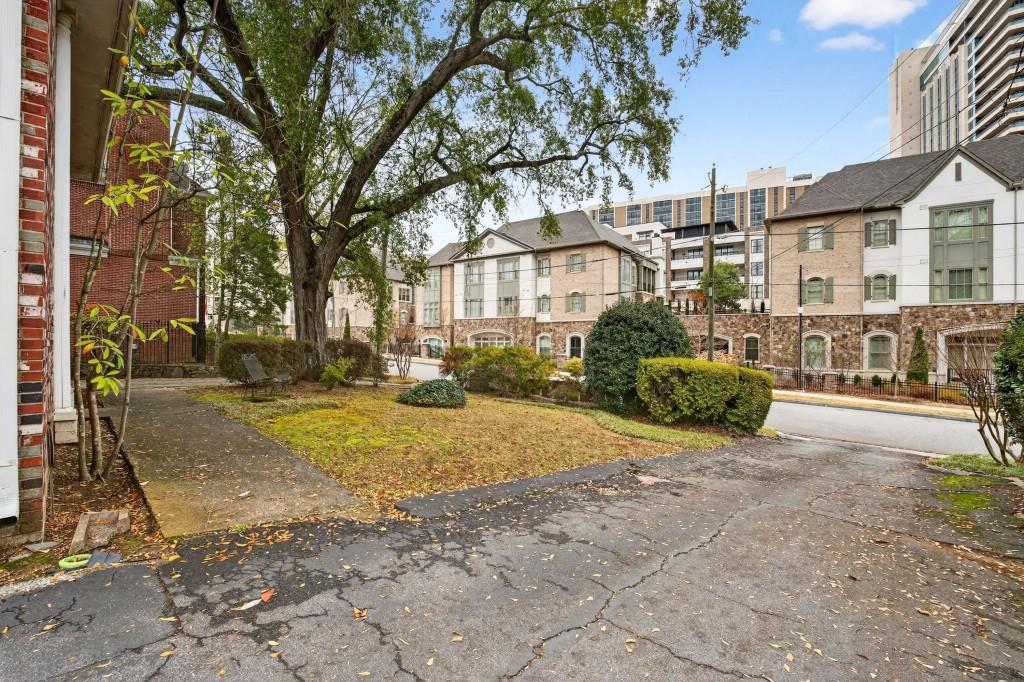 3668 Kingsboro Road Northeast, Unit 8 Atlanta, GA 30319 - Photo 8 of 43 a view of road with large trees