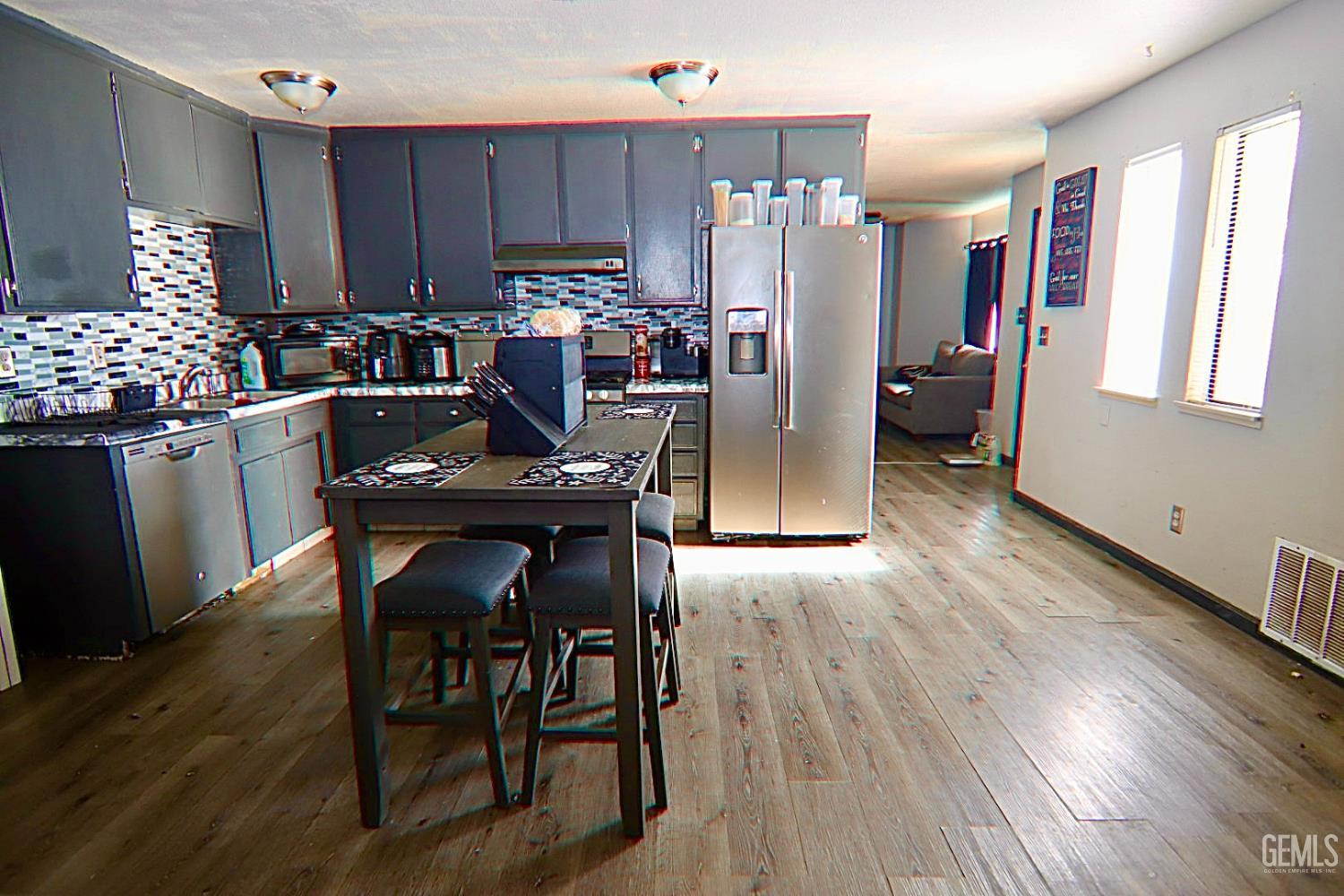 Undisclosed Address Ridgecrest, CA 93555 - Photo 7 of 8 a view of a dining room with furniture window and wooden floor