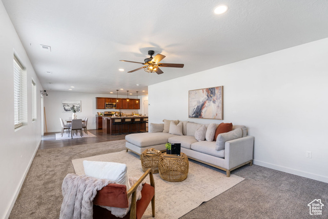 3456 South Linden Way Syracuse, UT 84075 - Photo 14 of 50 Living area with baseboards, a ceiling fan, recessed lighting, and light carpet