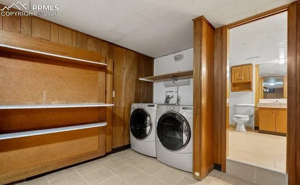 a utility room with washer and dryer