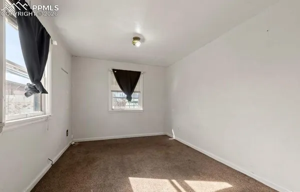 an empty room with windows