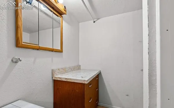a kitchen with stainless steel appliances granite countertop a stove a sink dishwasher and microwave