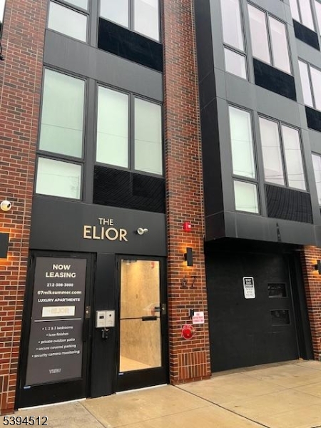 67 Dr Martin Luther King Jr Boulevard, Unit 204 Newark, NJ 07104 - Photo 27 of 27 a front view of a building with garage