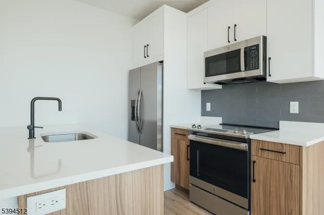 a kitchen with a stove and a microwave