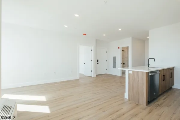 a view of a kitchen with wooden floor
