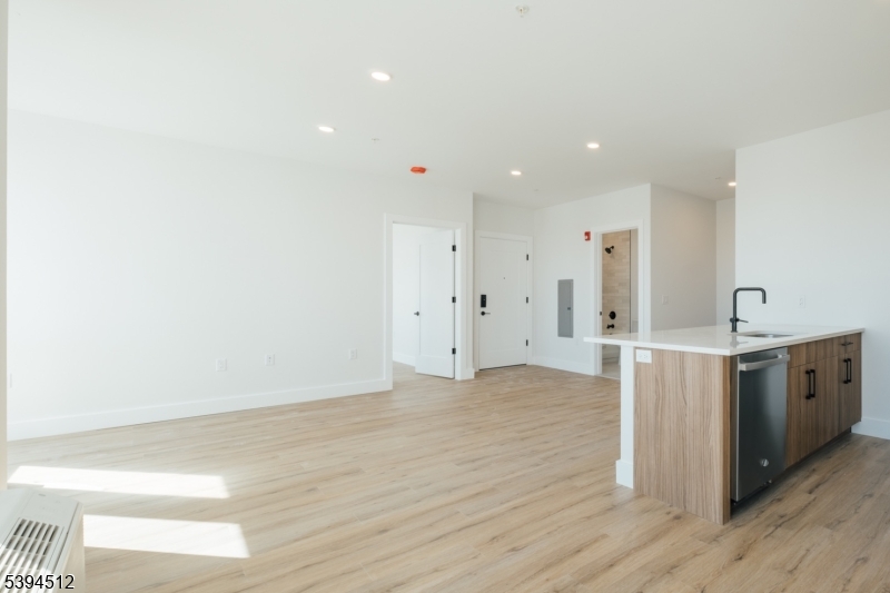 67 Dr Martin Luther King Jr Boulevard, Unit 204 Newark, NJ 07104 - Photo 5 of 27 a view of a kitchen with wooden floor