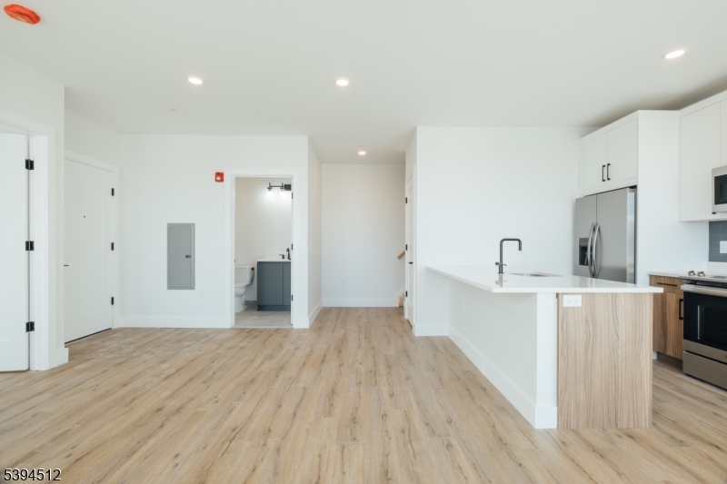 67 Dr Martin Luther King Jr Boulevard, Unit 204 Newark, NJ 07104 - Photo 8 of 27 a view of a kitchen with wooden floor