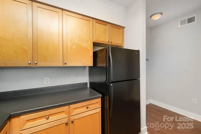 a kitchen with a stove a sink and a microwave