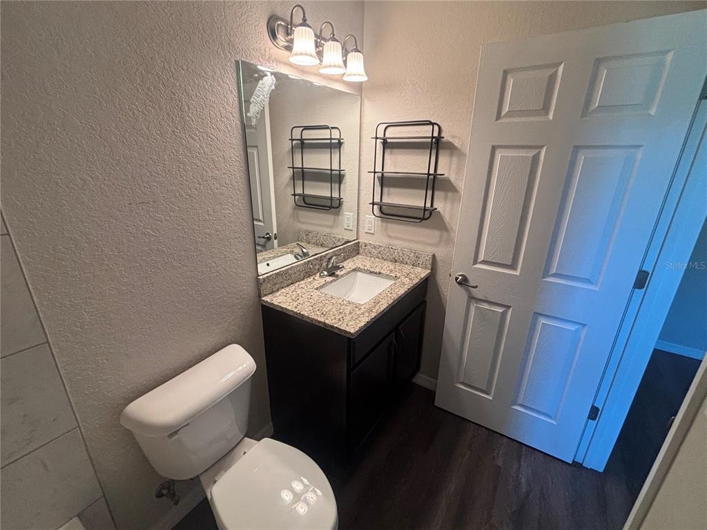 6561 Southwest 129th Loop Ocala, FL 34473 - Photo 13 of 21 a bathroom with a toilet sink and mirror