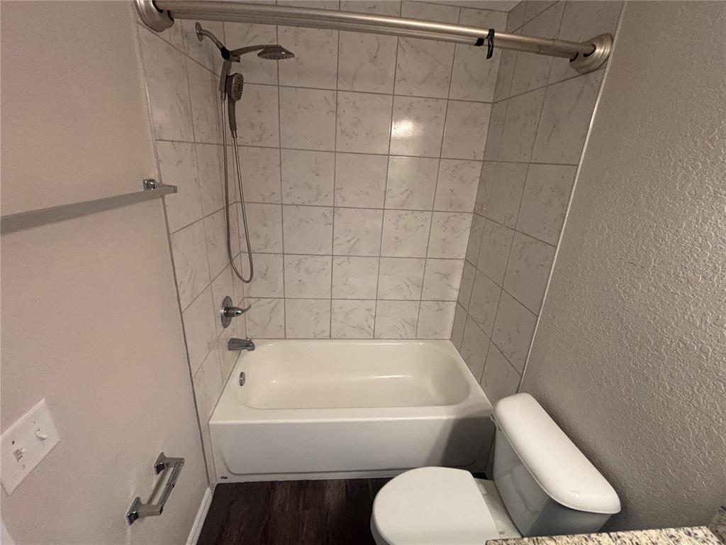 6561 Southwest 129th Loop Ocala, FL 34473 - Photo 14 of 21 a white bath tub sitting next to a white toilet