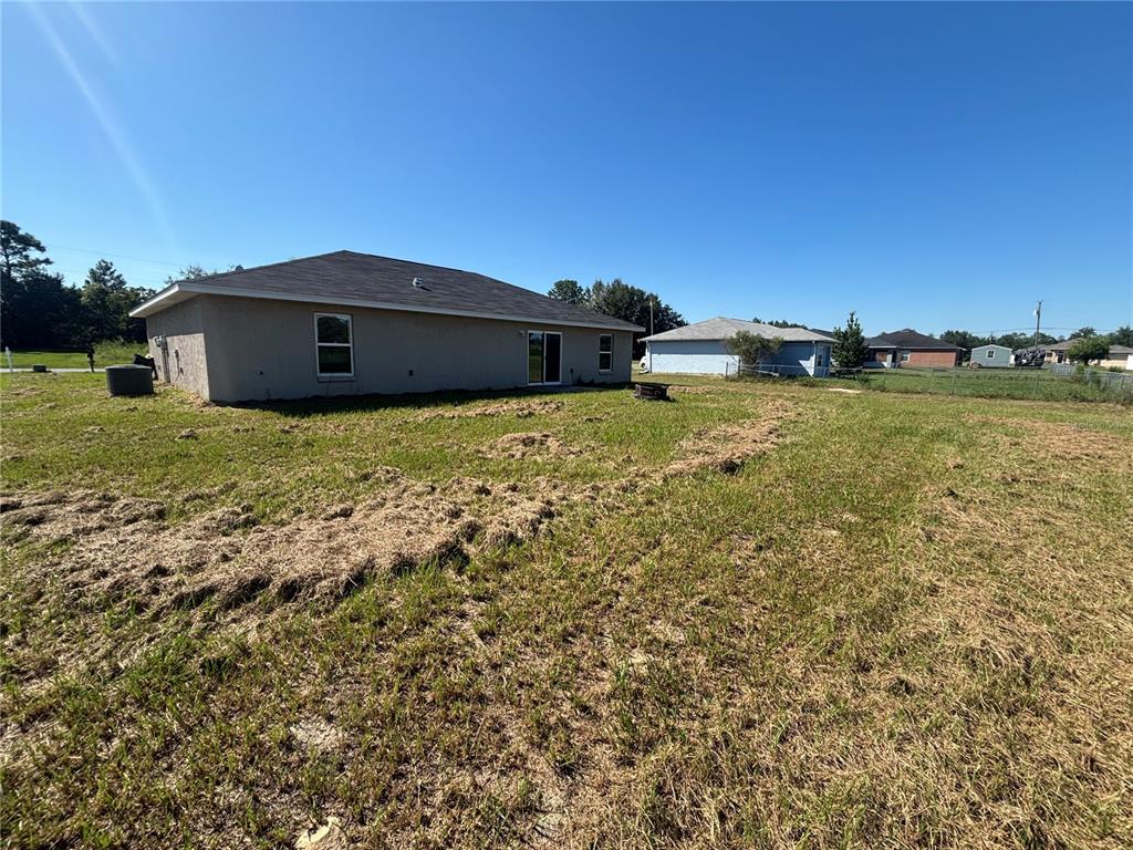 6561 Southwest 129th Loop Ocala, FL 34473 - Photo 20 of 21 a house with a yard