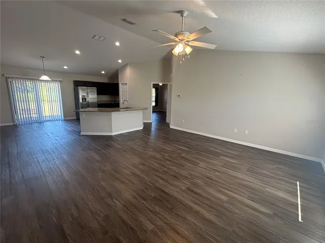 a view of kitchen with cabinets and wooden floor