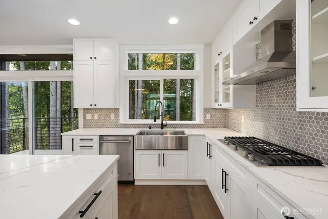 a view of a kitchen with a refrigerator and a window