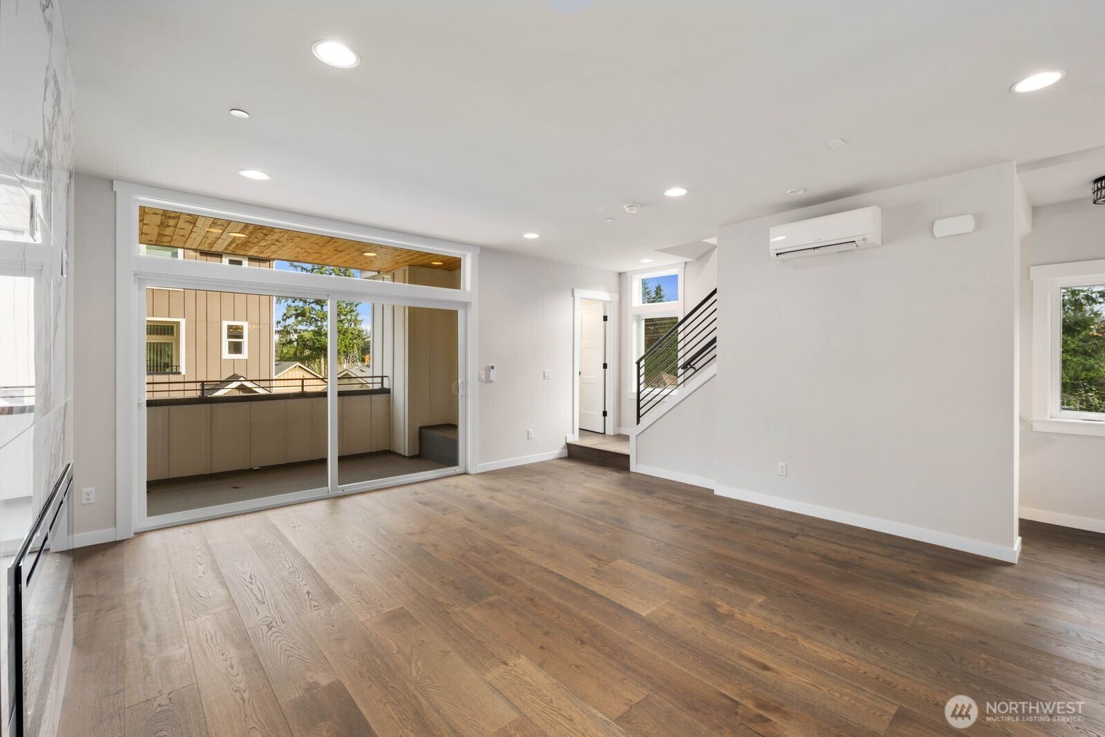 19722 Filbert Drive, Unit 10 Bothell, WA 98012 - Photo 22 of 33 a view of a big room with wooden floor and windows