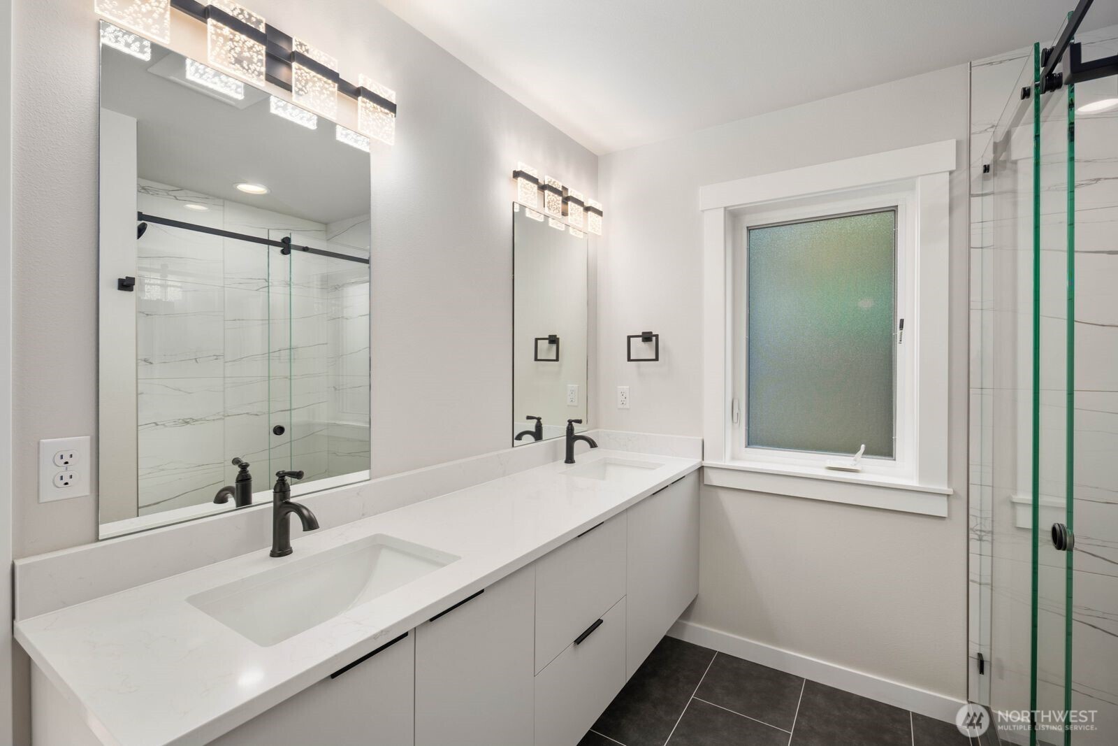 19722 Filbert Drive, Unit 10 Bothell, WA 98012 - Photo 30 of 33 a bathroom with a sink a toilet and shower