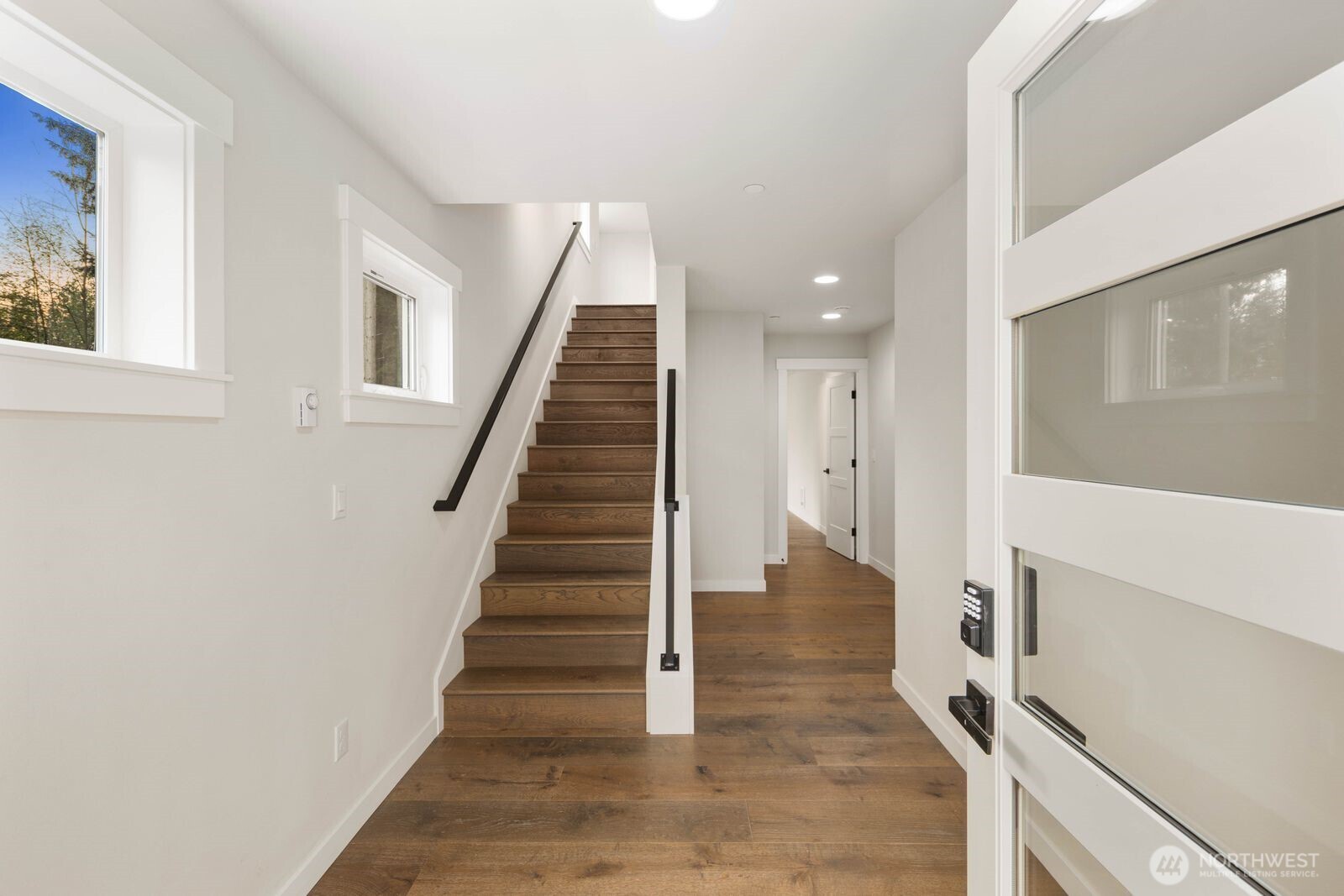 19722 Filbert Drive, Unit 10 Bothell, WA 98012 - Photo 5 of 33 a view of entryway and hall with wooden floor
