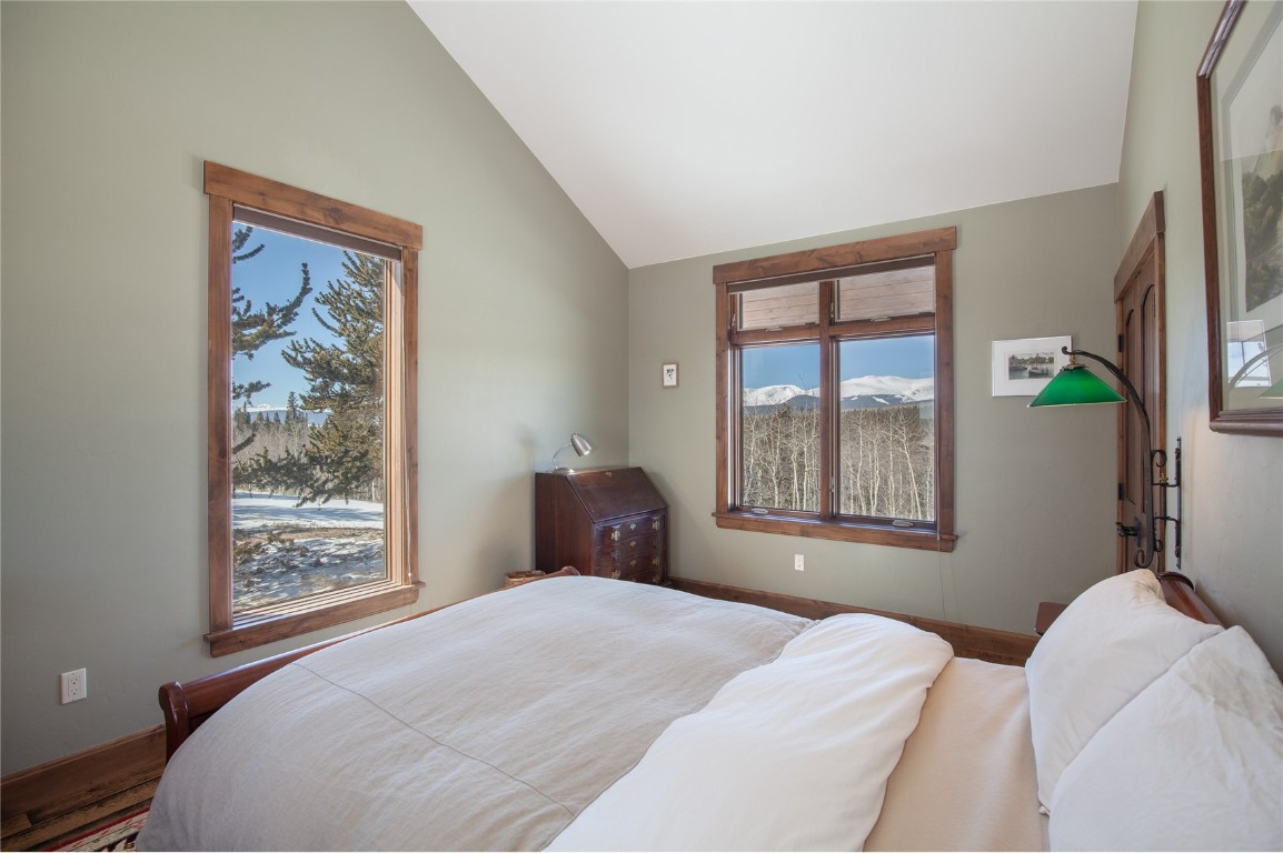 742 Lumberjack Road Fairplay, CO 80440 - Photo 16 of 35 a bedroom with a bed and wooden floor
