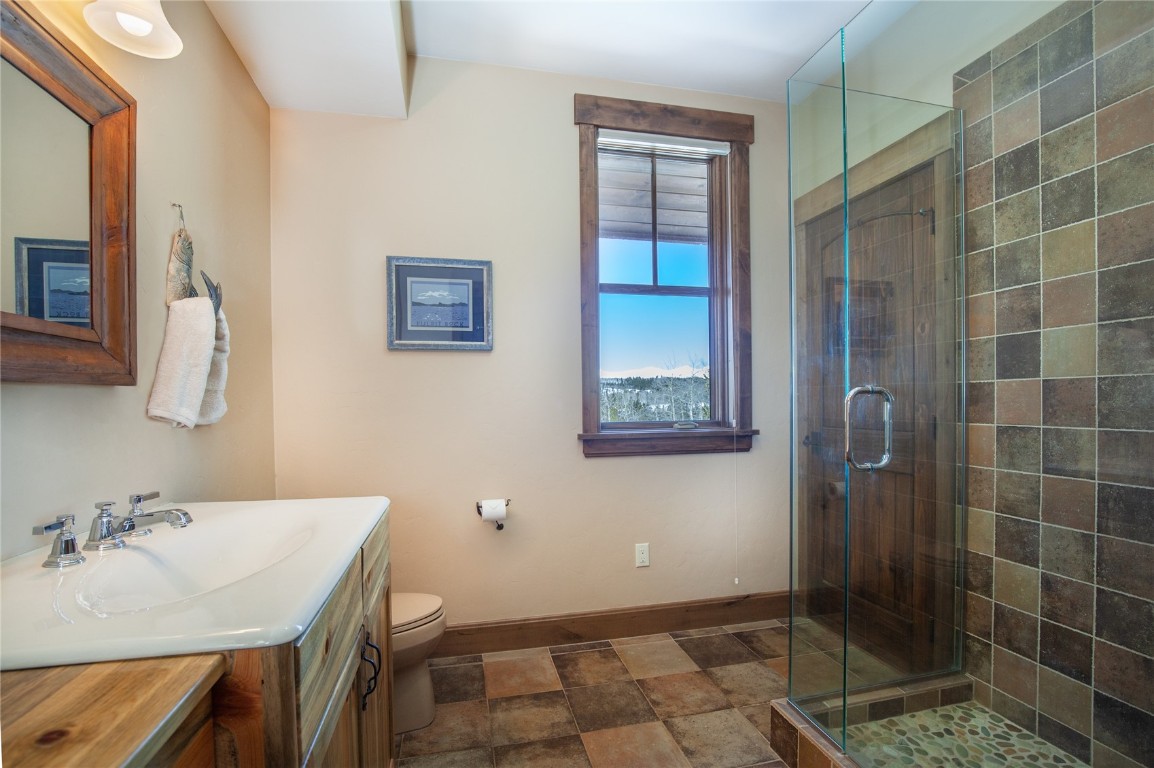 742 Lumberjack Road Fairplay, CO 80440 - Photo 21 of 35 a bathroom with a sink toilet and shower