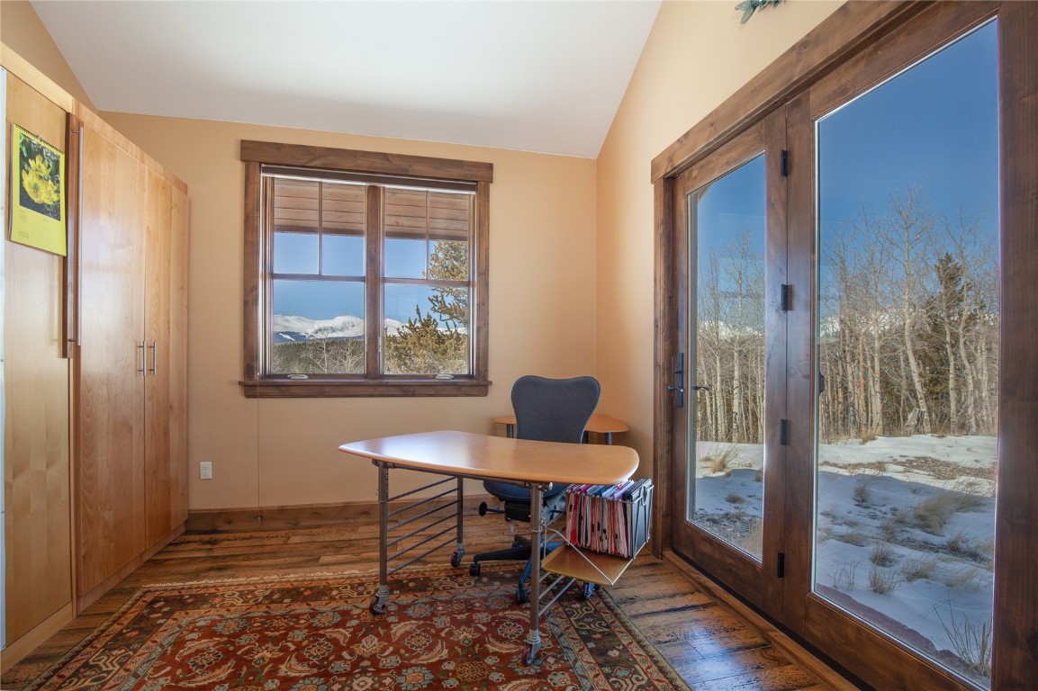 742 Lumberjack Road Fairplay, CO 80440 - Photo 24 of 35 a room that has a table and a chair with wooden floor next to a window
