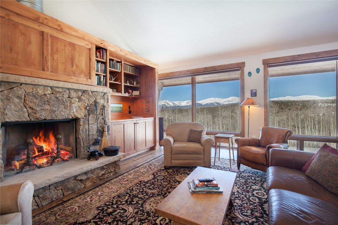 742 Lumberjack Road Fairplay, CO 80440 - Photo 7 of 35 a living room with furniture and a fireplace