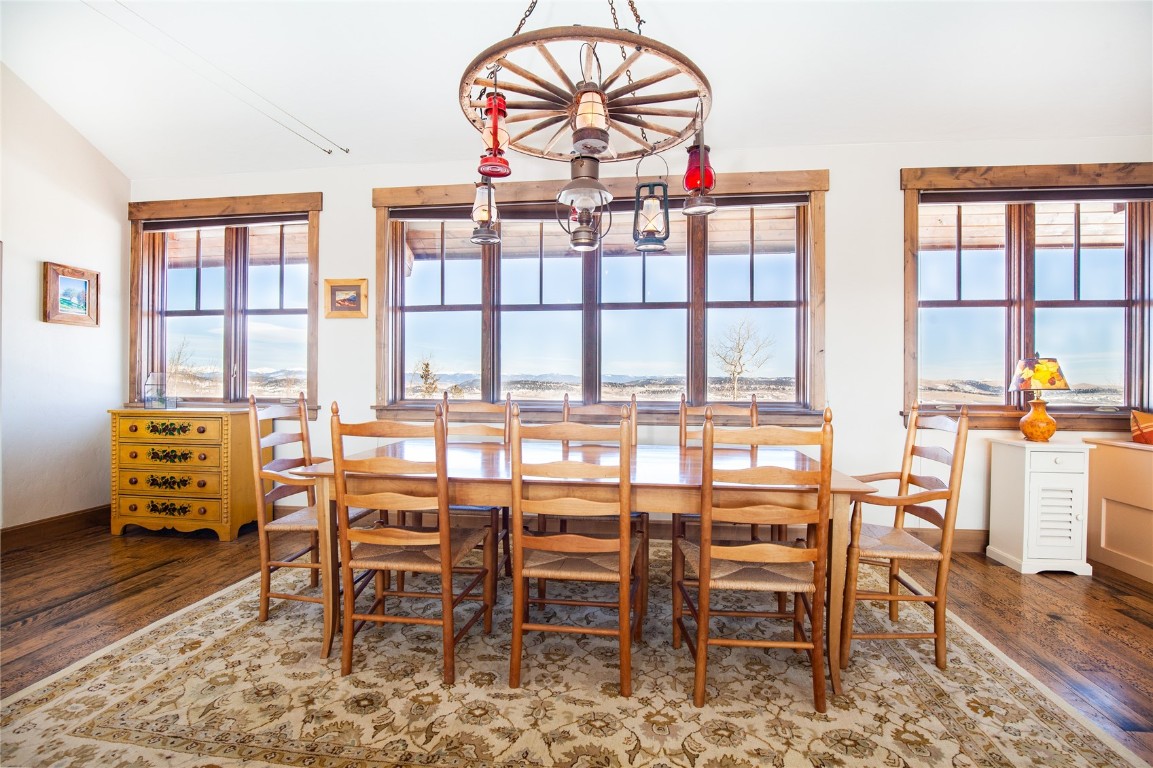 742 Lumberjack Road Fairplay, CO 80440 - Photo 9 of 35 a dining room with furniture a chandelier and a rug