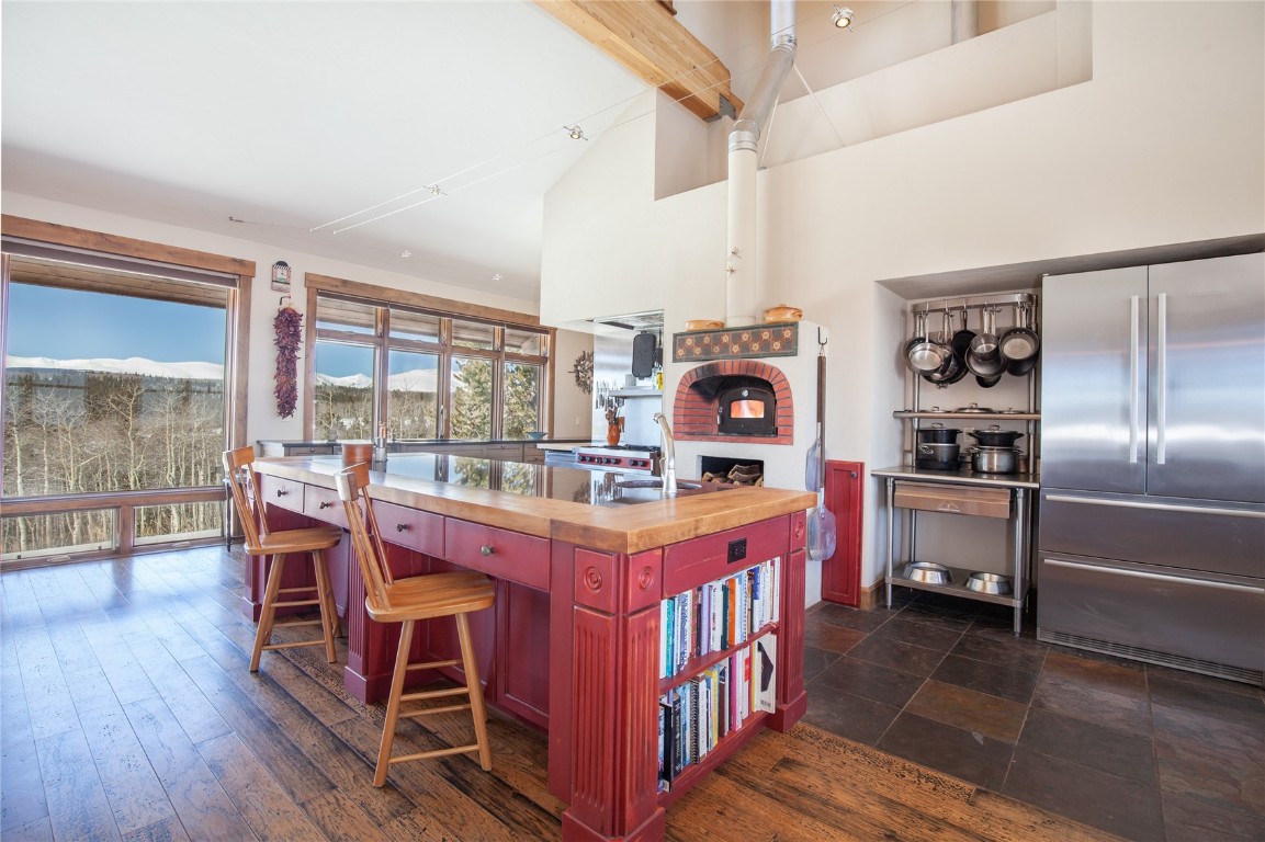 742 Lumberjack Road Fairplay, CO 80440 - Photo 10 of 35 a kitchen with stainless steel appliances granite countertop a stove and chairs