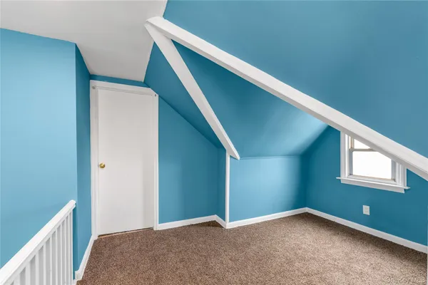 a view of an empty room with windows