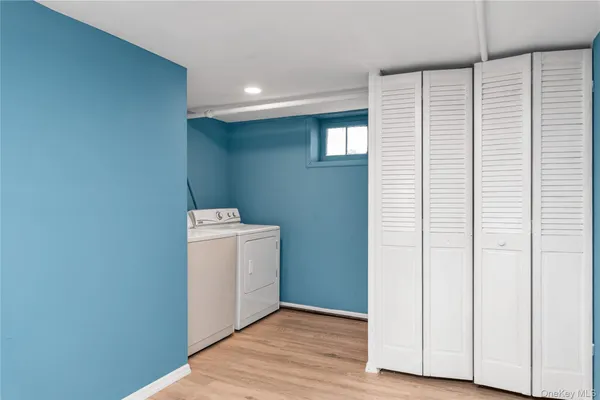 a view of a kitchen with wooden floor