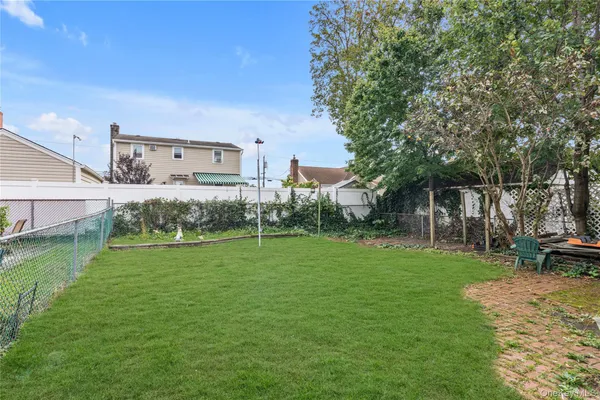 a view of a backyard with a garden and plants