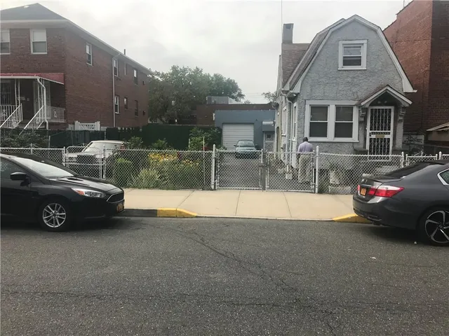 a view of a car parked in front of a house