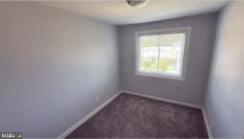 866 Bellevue Street Southeast, Unit 1 Washington, DC 20032 - Photo 6 of 9 an empty room with a window