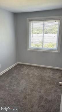866 Bellevue Street Southeast, Unit 1 Washington, DC 20032 - Photo 7 of 9 an empty room with a window