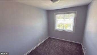 866 Bellevue Street Southeast, Unit 1 Washington, DC 20032 - Photo 8 of 9 an empty room with a window