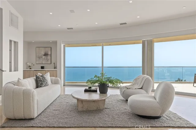 a living room with fireplace furniture and a flat screen tv