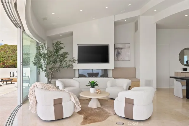 a roof deck with a table and chairs