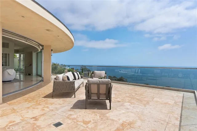 a bathroom with a granite countertop sink a toilet and mirror