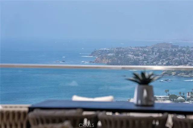 a spacious bedroom with a bed and a large window