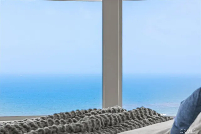 a kitchen with kitchen island granite countertop a sink and a refrigerator