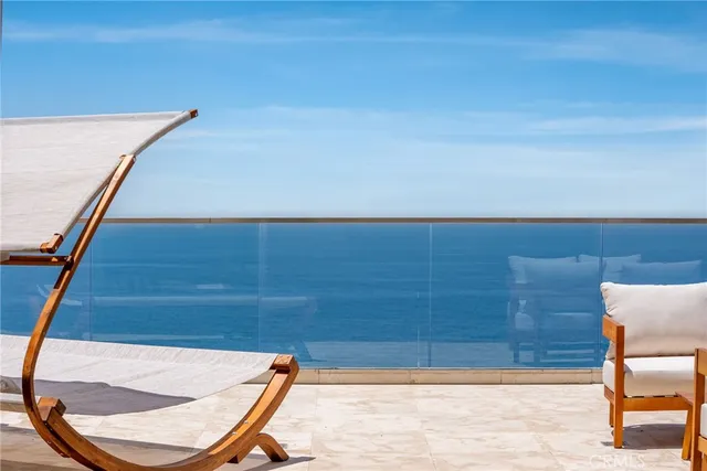 a terrace of a house with outdoor seating