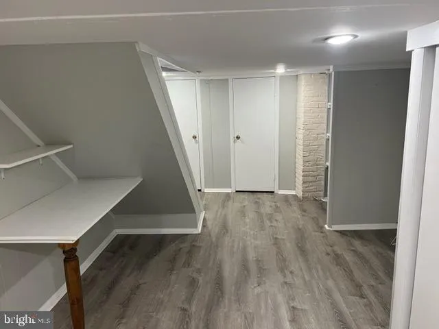 a view of entryway with wooden floor