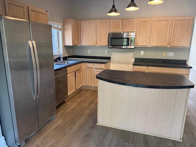 2420 Southeast Springtree Place Stuart, FL 34997 - Photo 6 of 18 a kitchen with stainless steel appliances granite countertop a refrigerator a stove a sink and a microwave oven with wooden floor