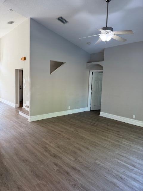 2420 Southeast Springtree Place Stuart, FL 34997 - Photo 9 of 18 a view of a room with wooden floor and chandelier