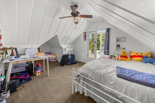 a bed room with a bed and a tv