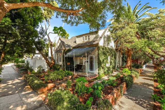front view of a house with a tree