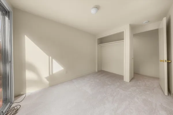 a view of a room with a wooden floor