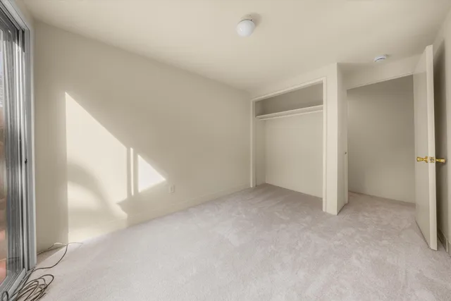 a view of a room with a wooden floor