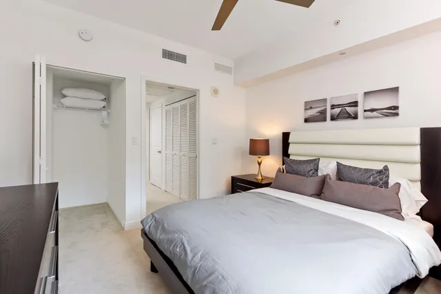 a bedroom with a bed and a television